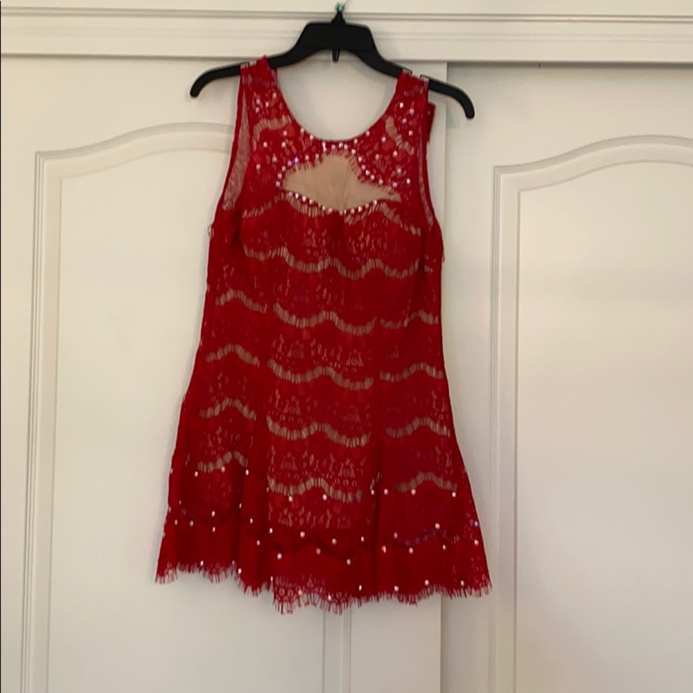 red lace dress with nude mesh detail and bedazzle
